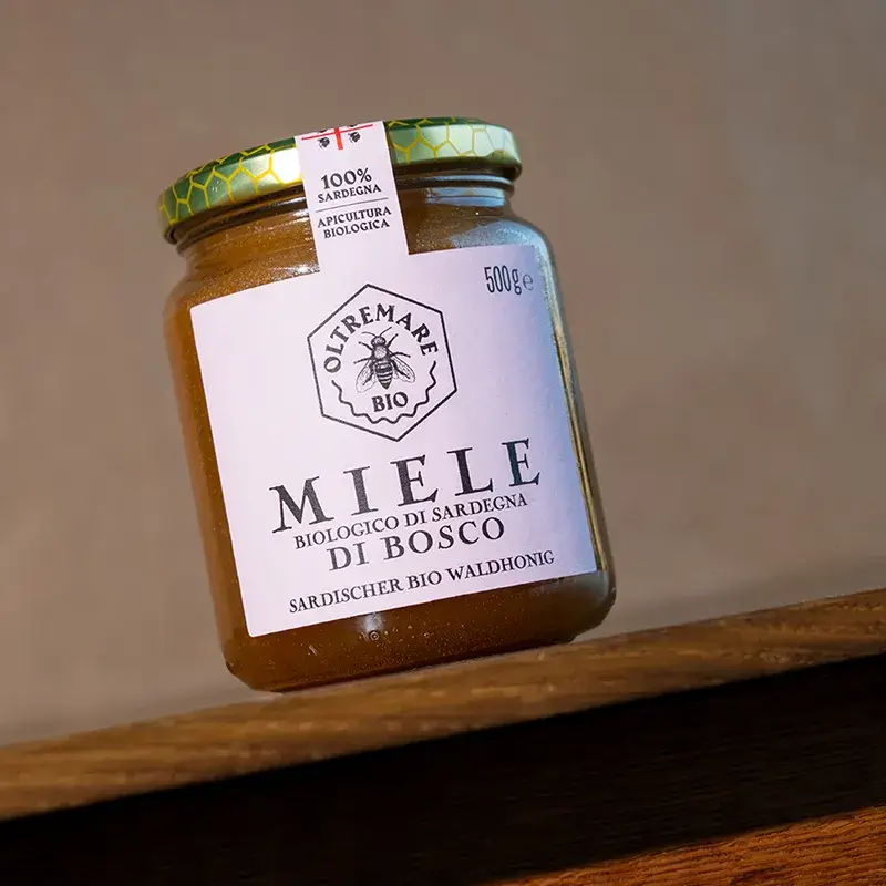 Organic raw bosco honey in a glass jar