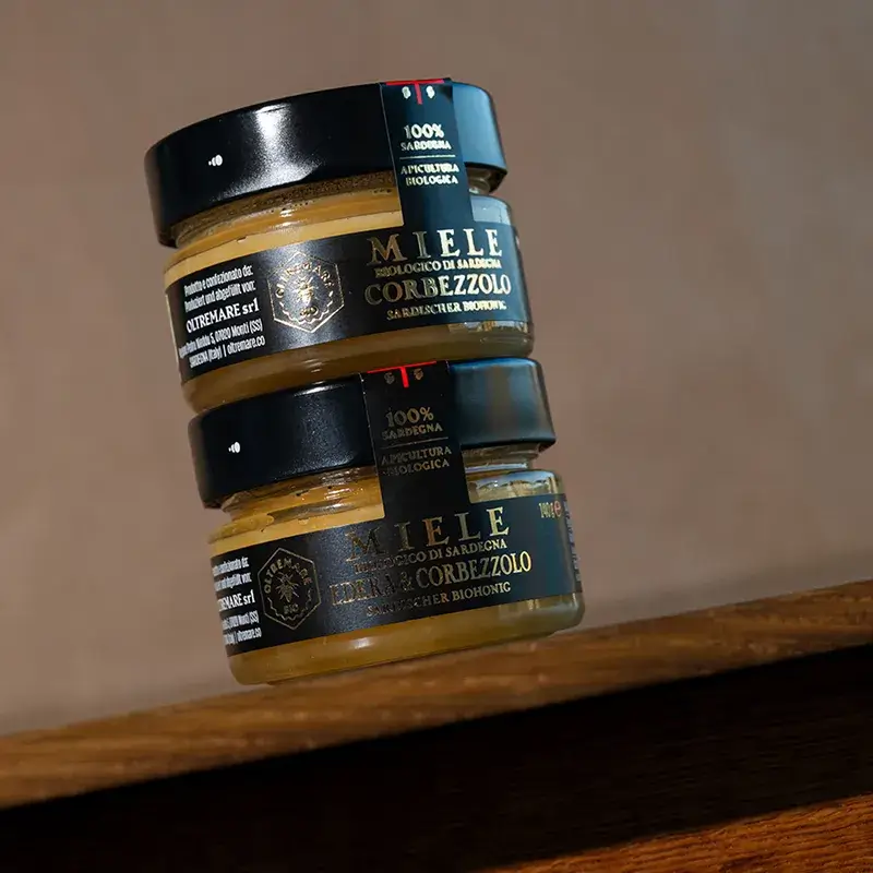 Organic raw corbezzolo honey in two glass jar