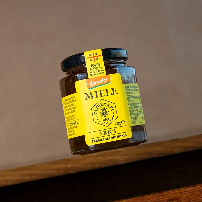 Organic raw erica honey in a glass jar